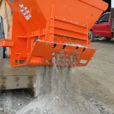 EZG Manufacturing Hog Crusher discharging pulverized debris